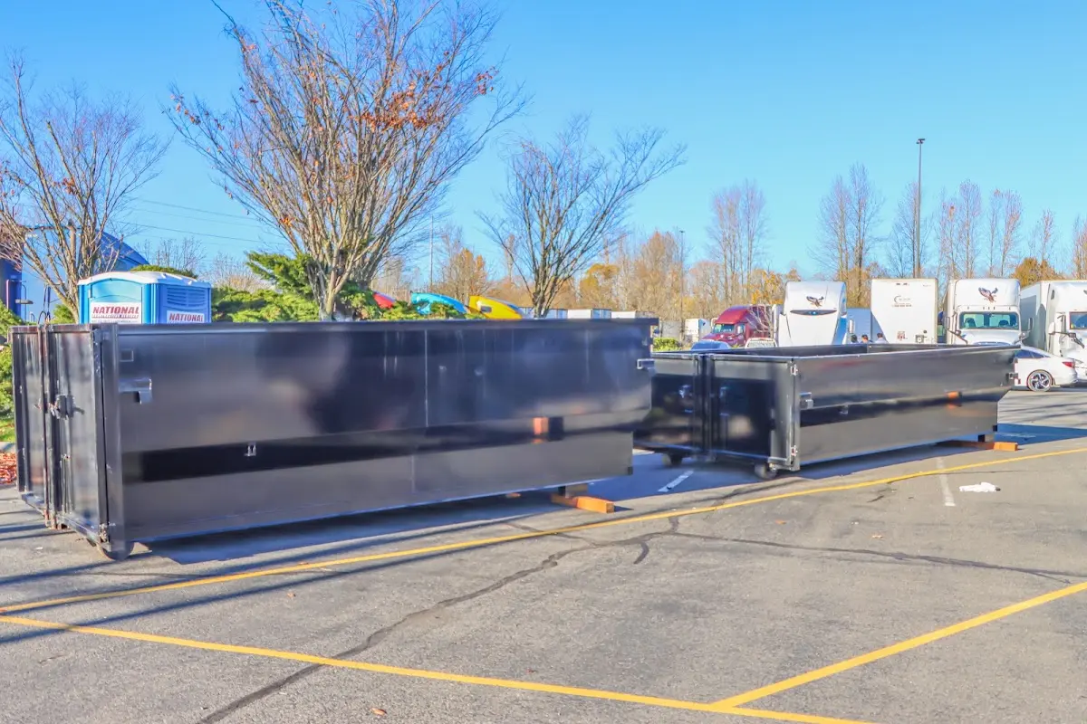 Professional dumpster rental service with roll-off container on residential driveway in Wooster